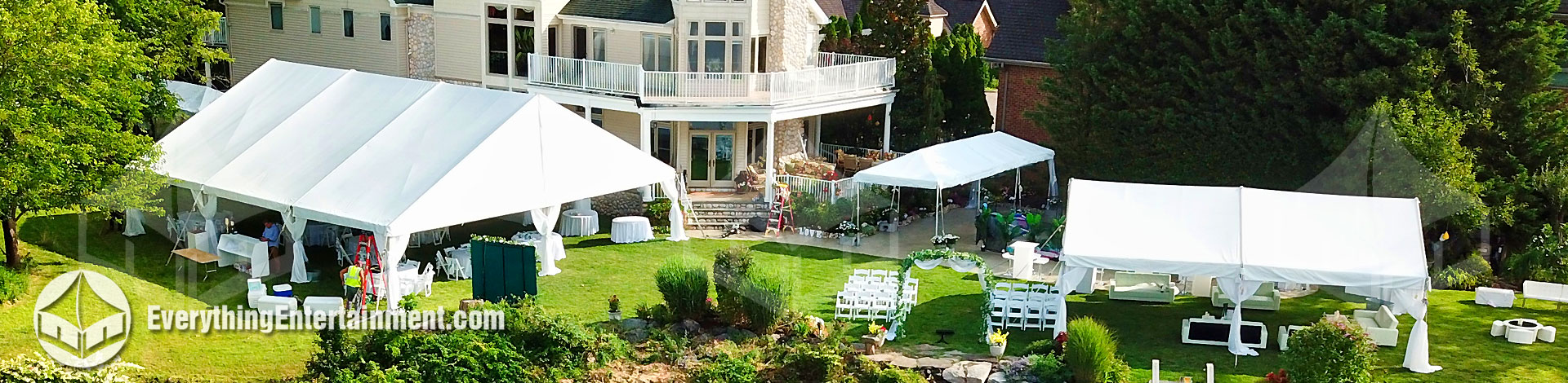 Several wedding tents setup in backyard