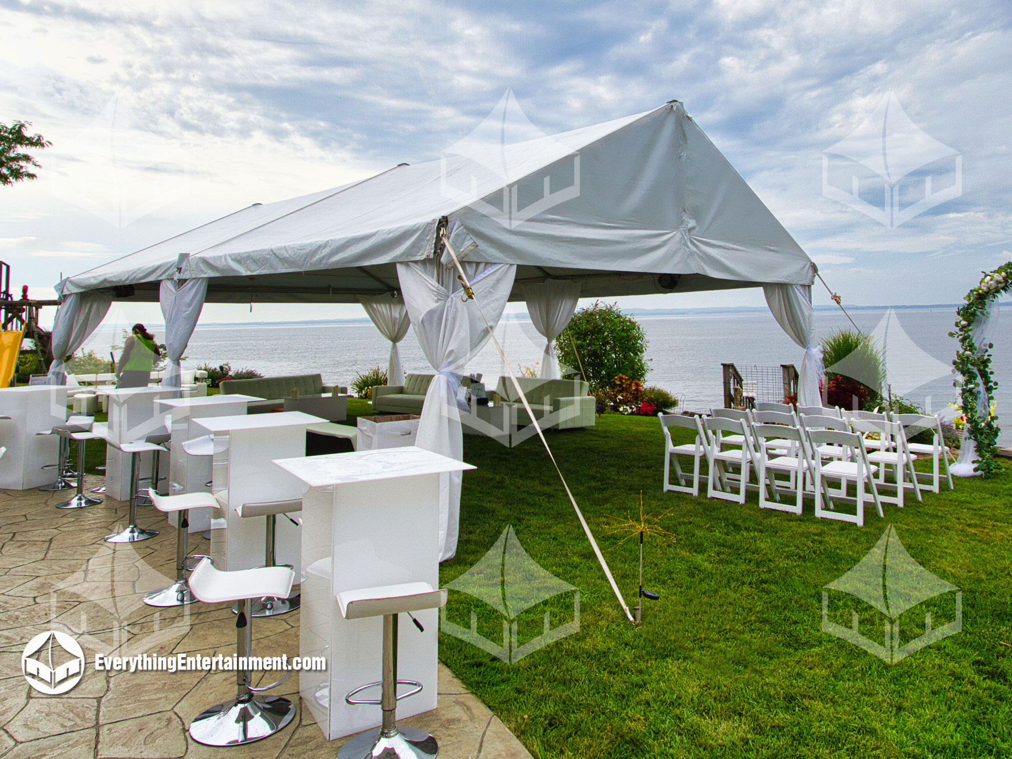 20x30 foot frame tent with leg drapes, overlooking the ocean