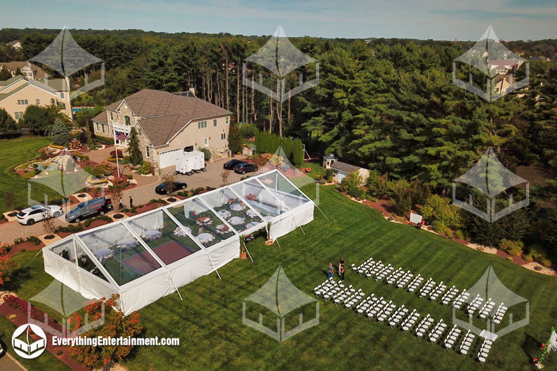 40x90 clear top frame tent setup on grass for backyard wedding