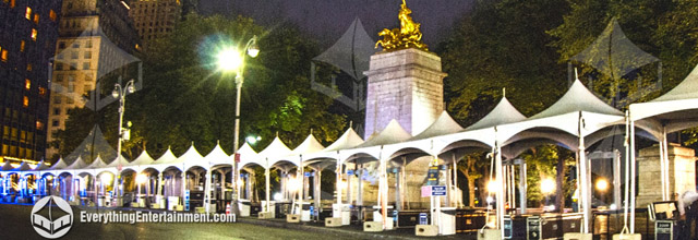 Dozens of high peak frame tents setup at Columbus circle by Central Park in NYC.