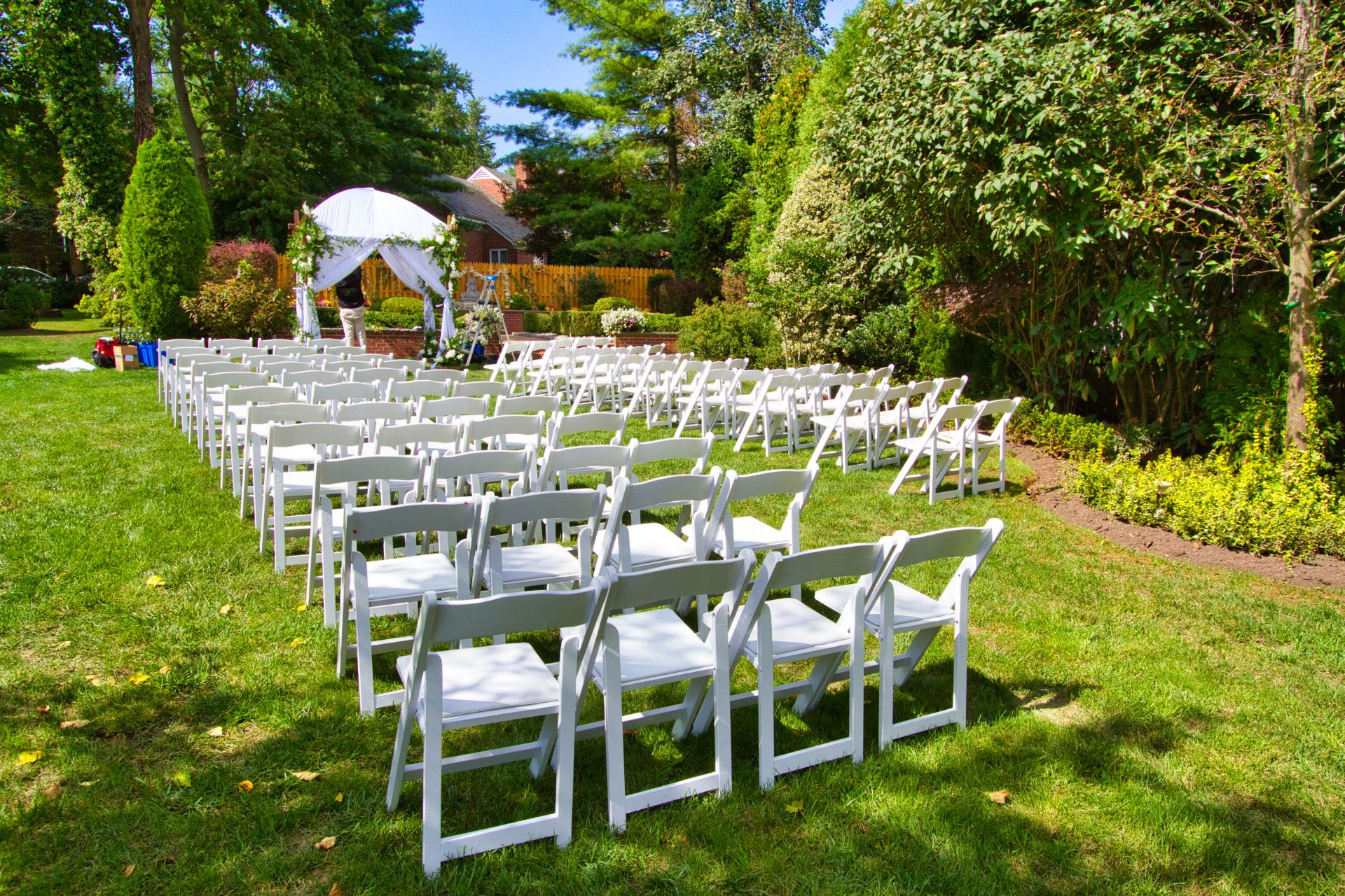 Garden Chairs setup for wedding ceremony on grass