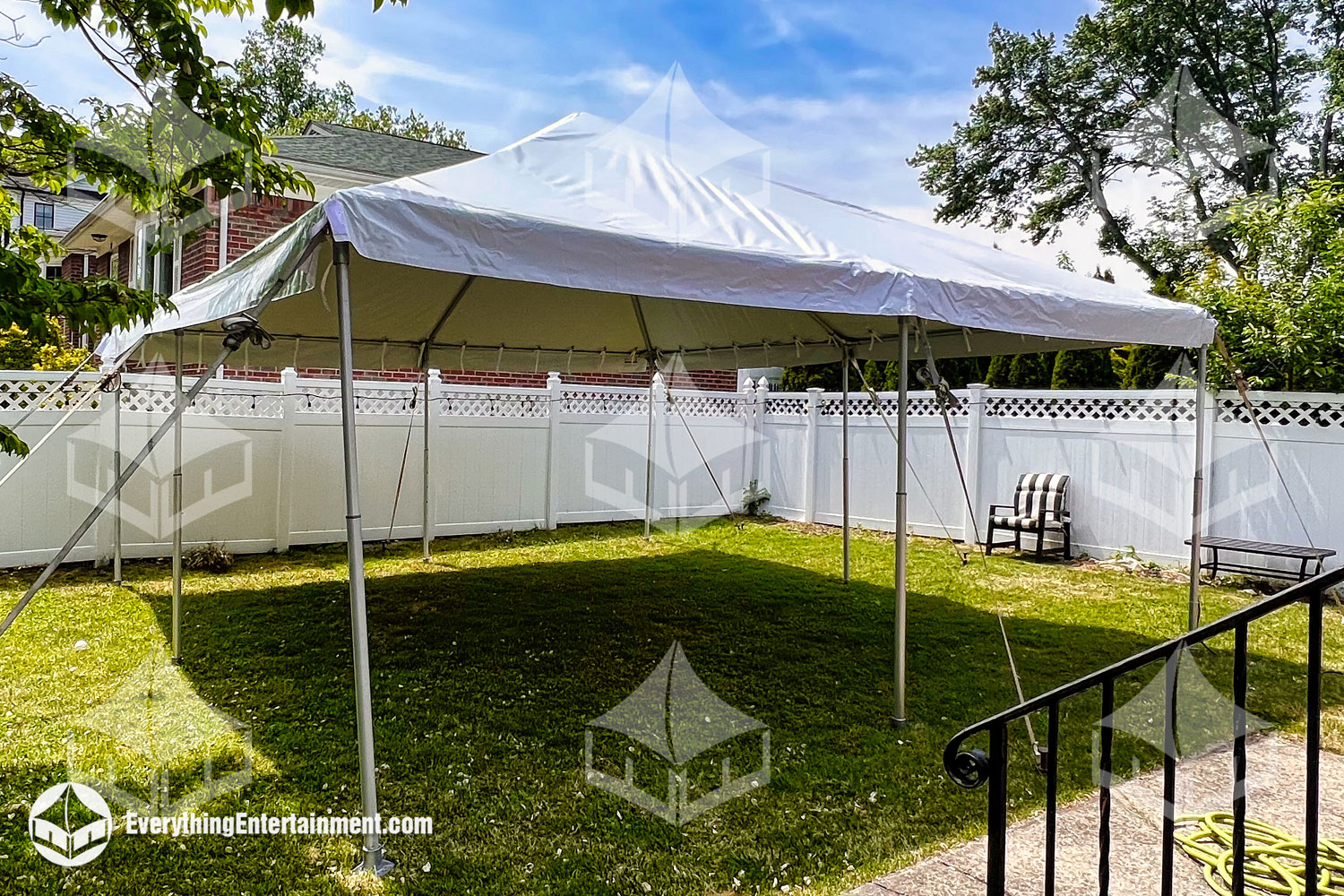 15x15 Party Tent with white top set up in backyard on grass