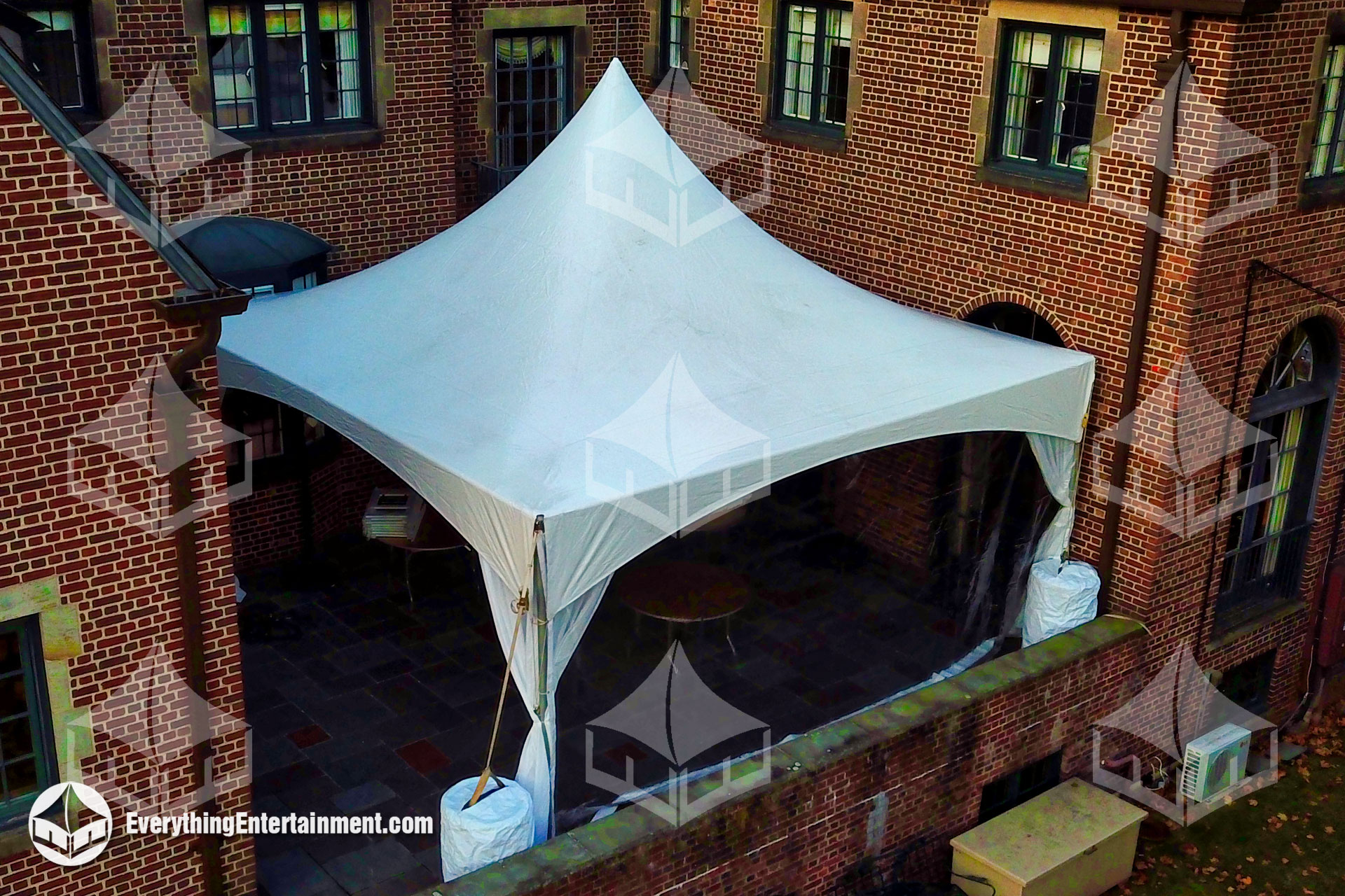 20x20 high peak marquee setup on deck in rear of house