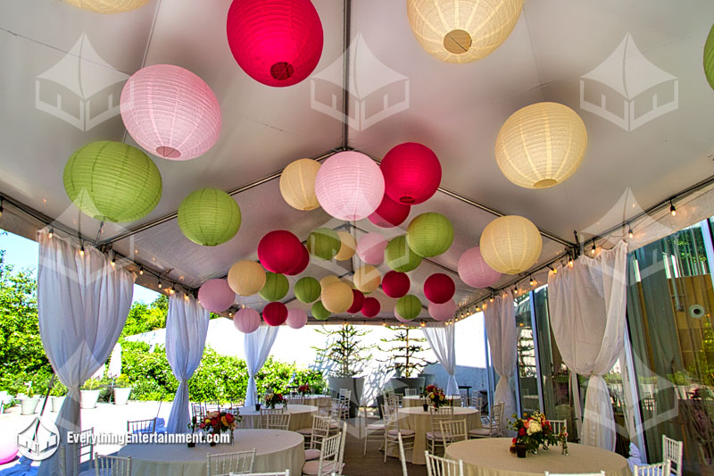 colorful paper lanterns in a white top tent