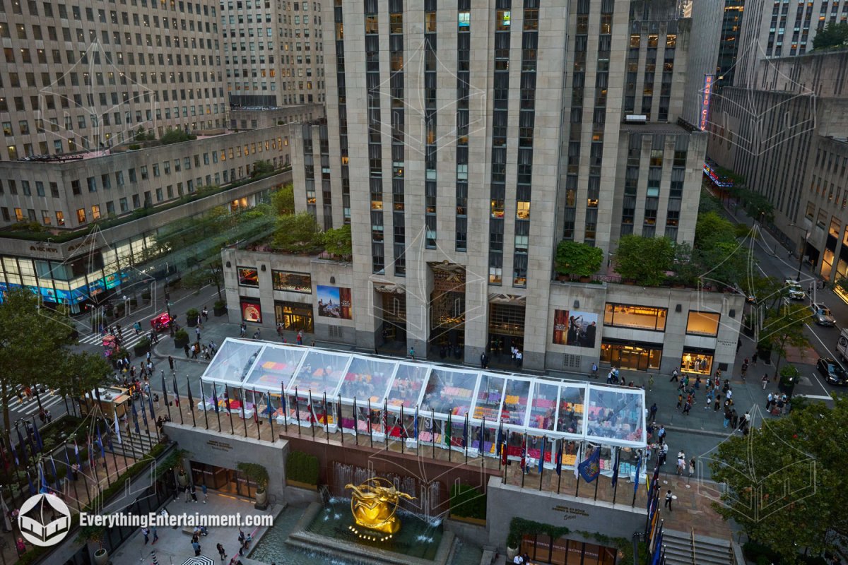High-angle aerial view of a 30x130 clear top frame tent installed in Rockefeller Center Plaza above the Prometheus Statue in NYC by Everything Entertainment.