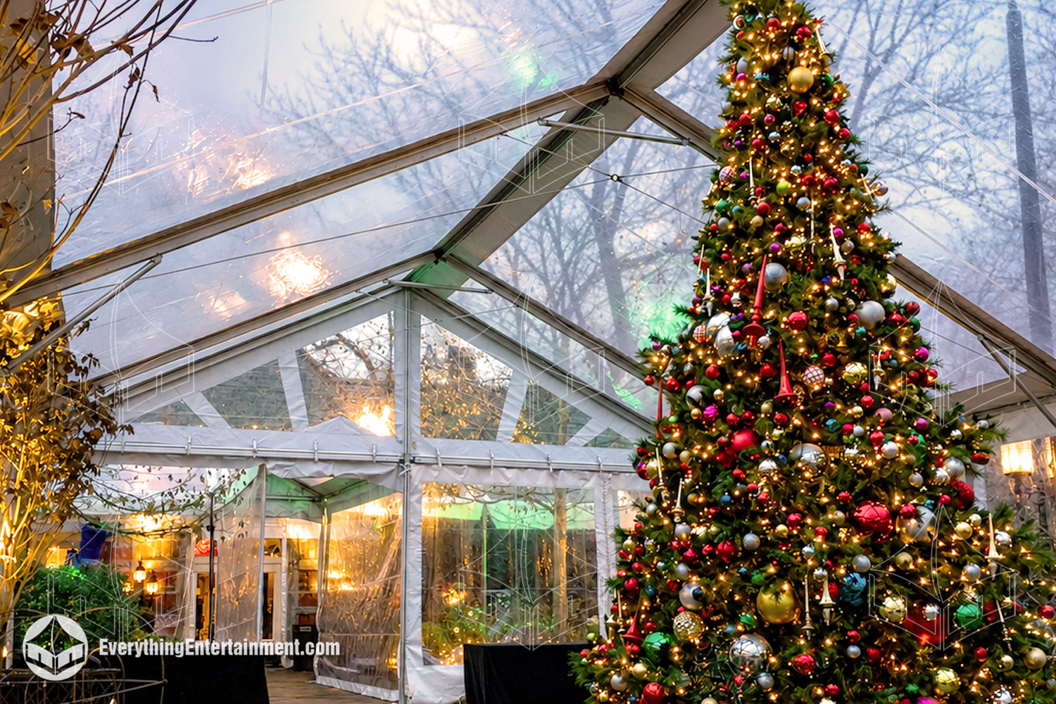 30x50 clear-top tent installed around a giant decorated Christmas tree for a winter event at Tavern on the Green in Central Park