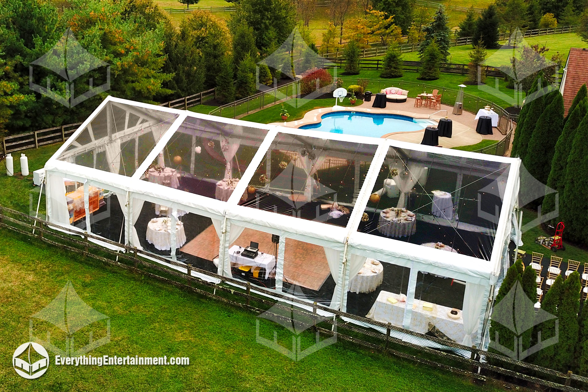 Aerial view of clear top wedding tent at a backyard party in New Jersey