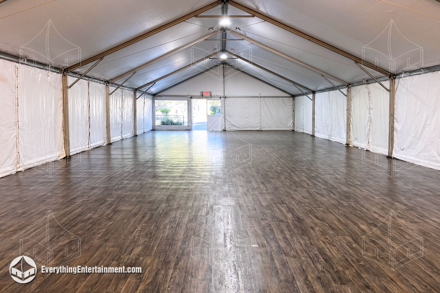 30x70 foot frame tent with white walls and vinyl wood floor