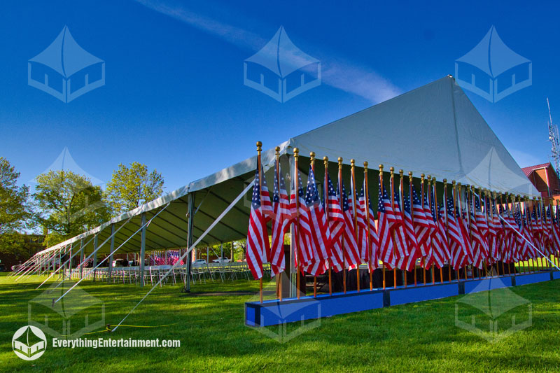 40x200 foot long frame tent on grass with American flags