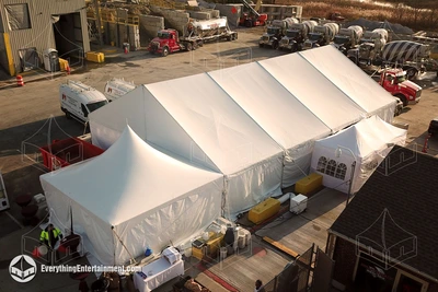 A 40x60 frame tent set up in a construction yard for food service in Staten Island, NY