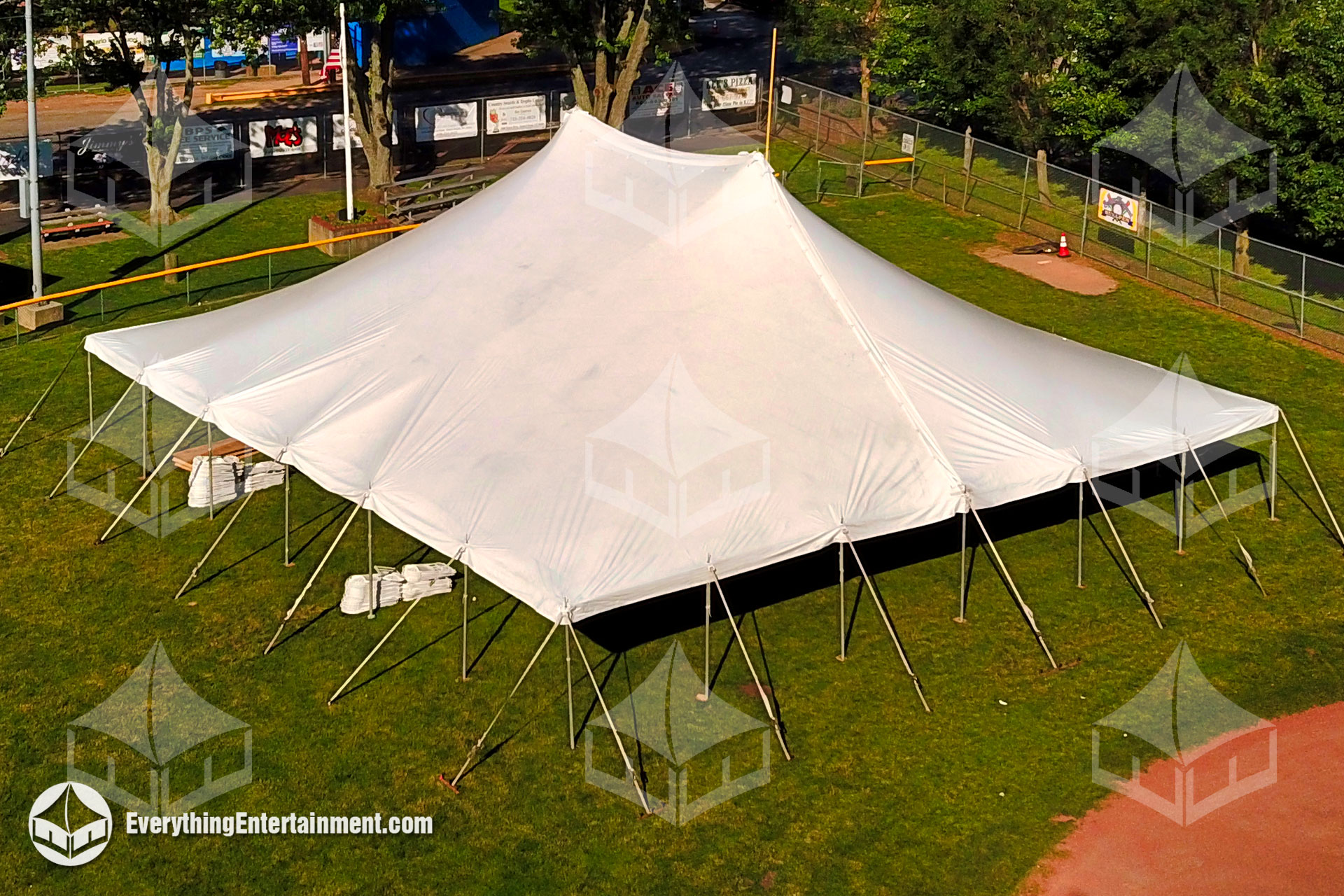 60ft x 60ft tension tent setup on a grass field