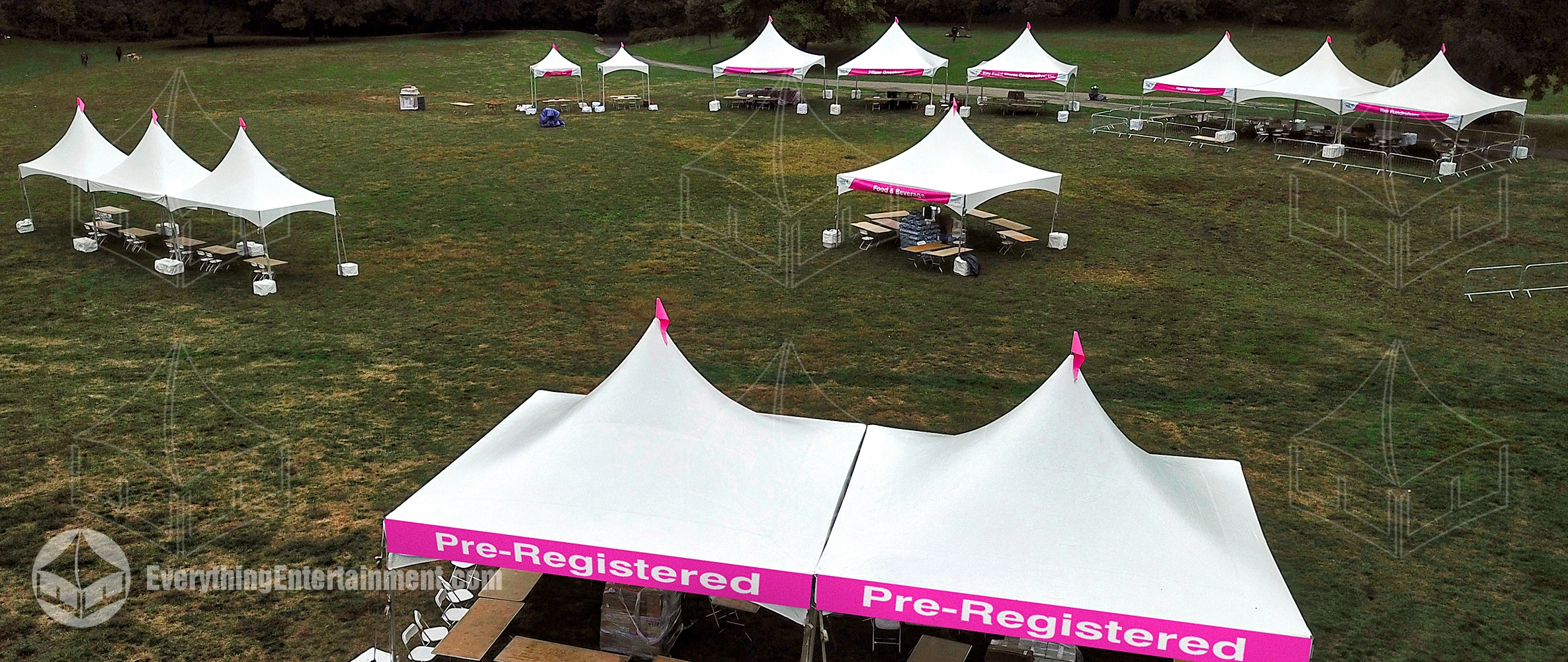 Multiple high peak tent rentals at sunrise for an awareness walk in Prospect Park, Brooklyn