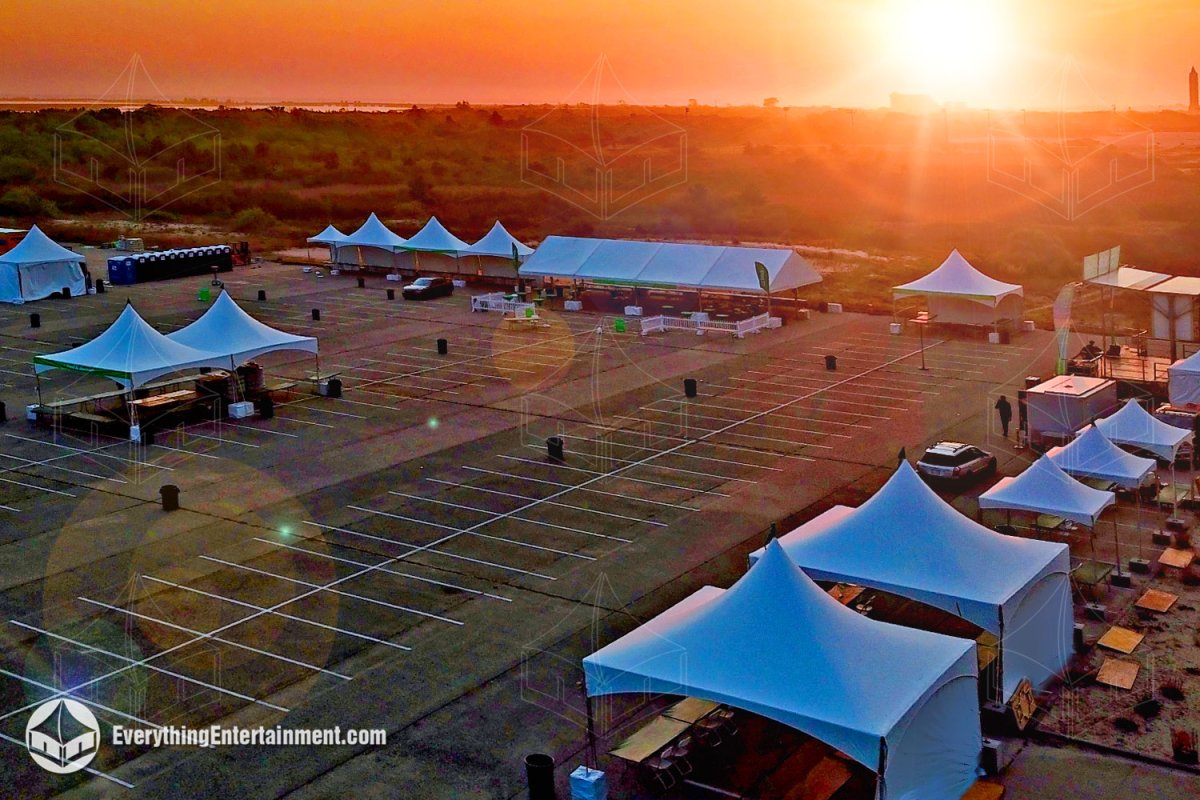 Everything Entertainment high-peak frame tents arranged in a parking lot for a fundraising walk at Jones Beach State Park, Nassau County, Long Island.