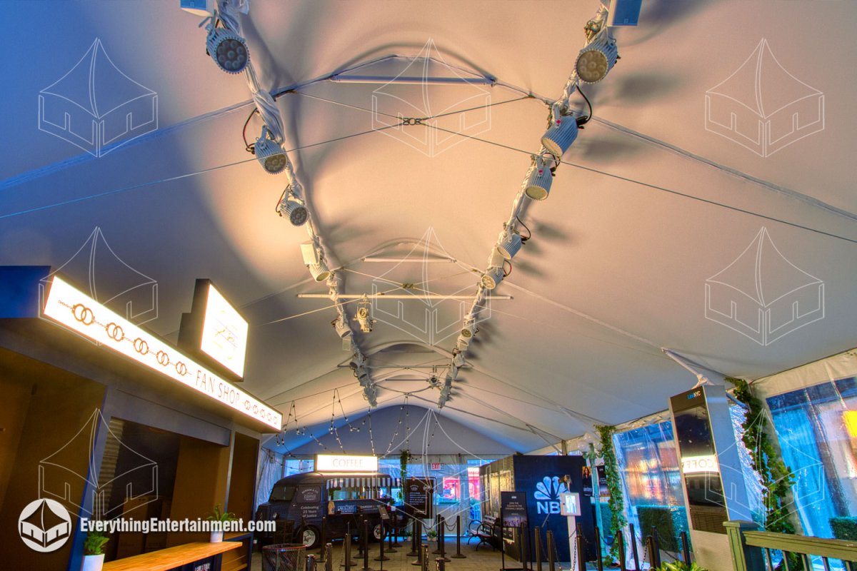 Overhead aerial view of a 30x65 white frame tent displaying printed branding on the roof at Rockefeller Center.
