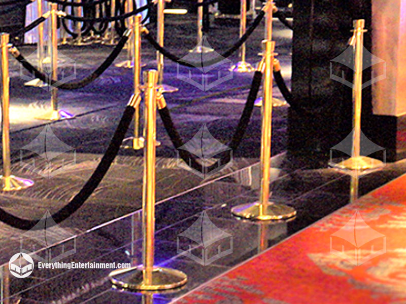 chrome stanchions setup on grass at graduation