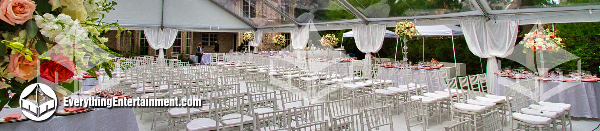 interior of a clear top tent with balloom chairs setup for a wedding ceremony