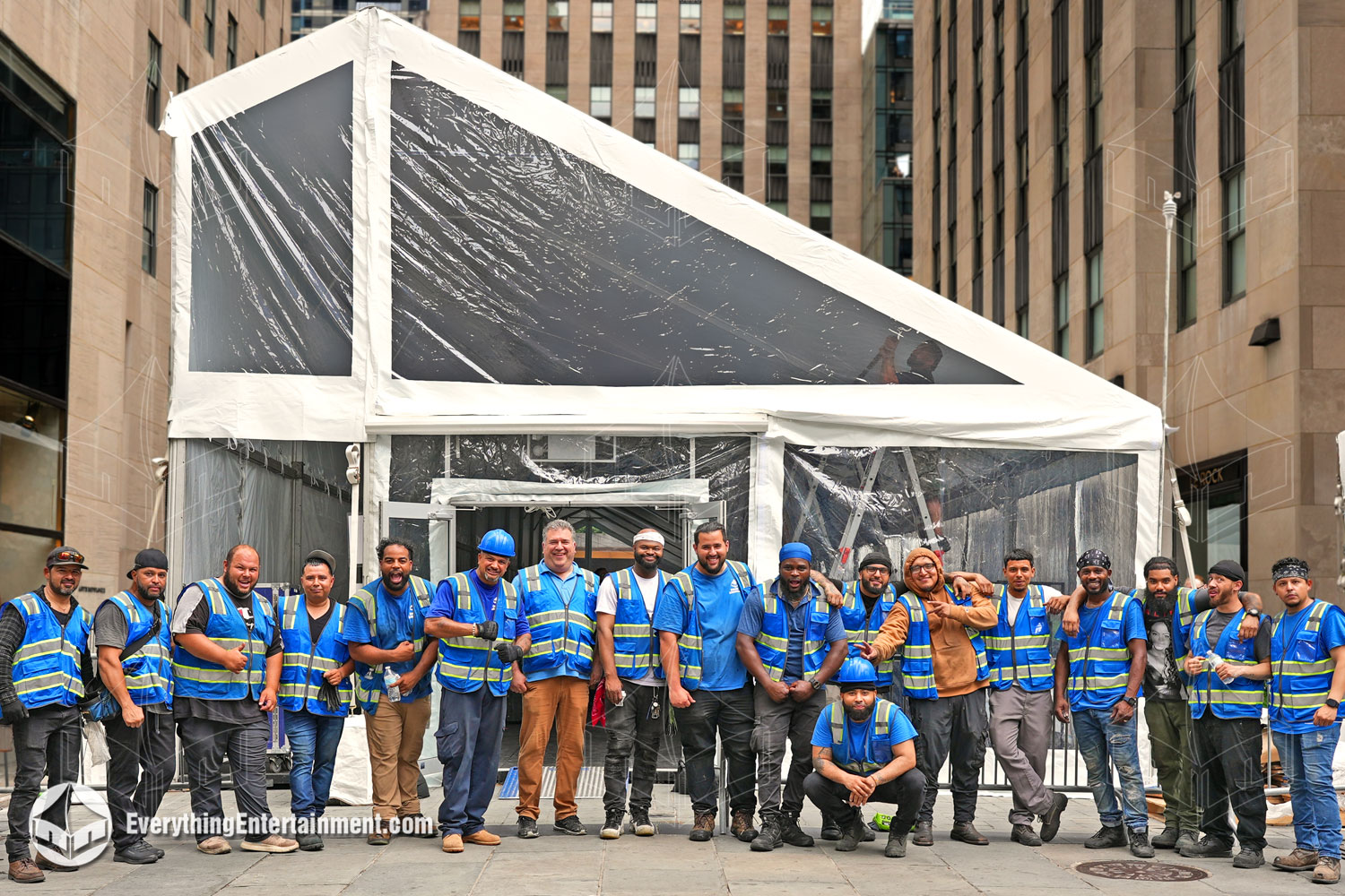 The Everything Entertainment crew standing in front of a large mono-pitch tent in Manhattan