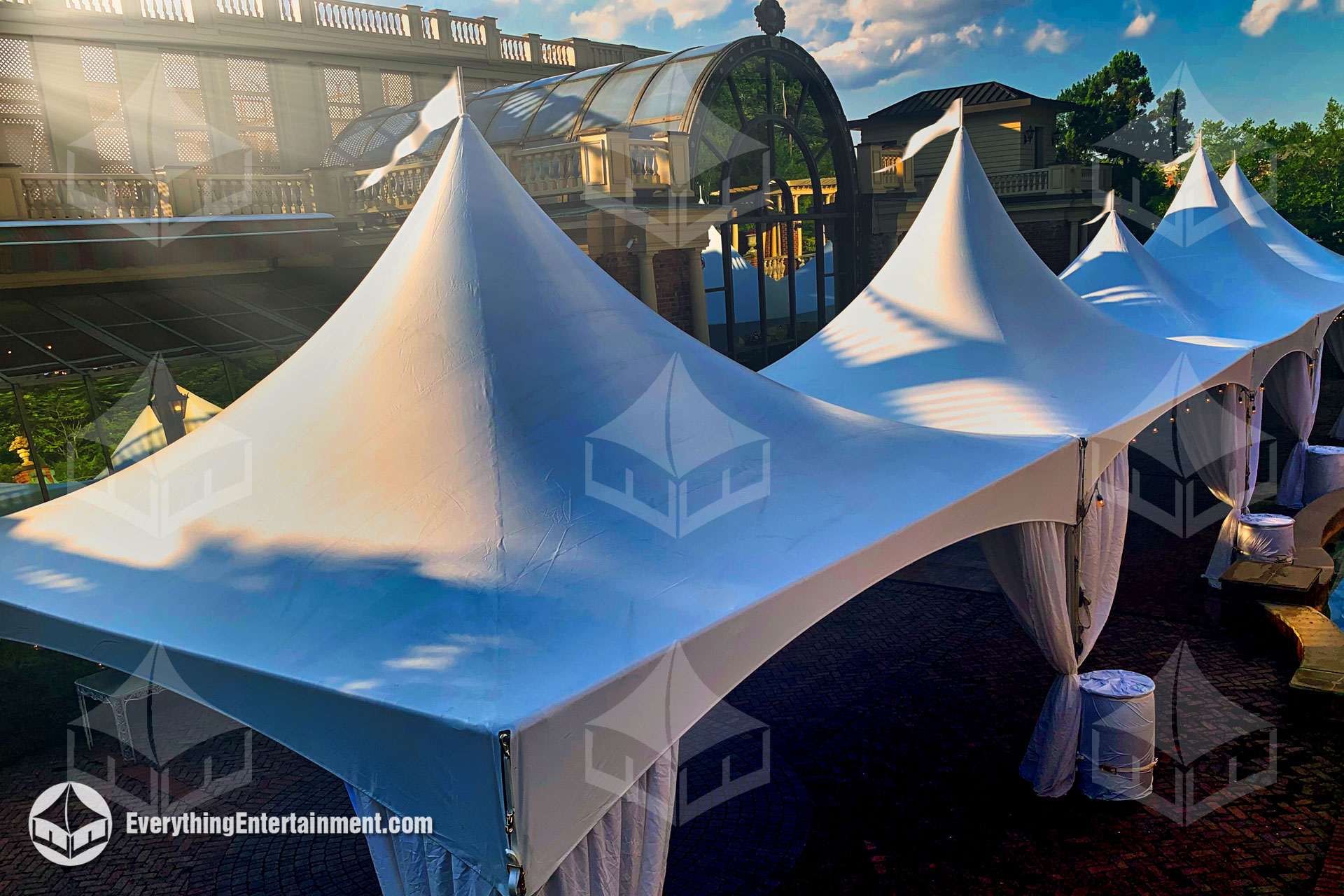 five high peak tents at a wedding venue