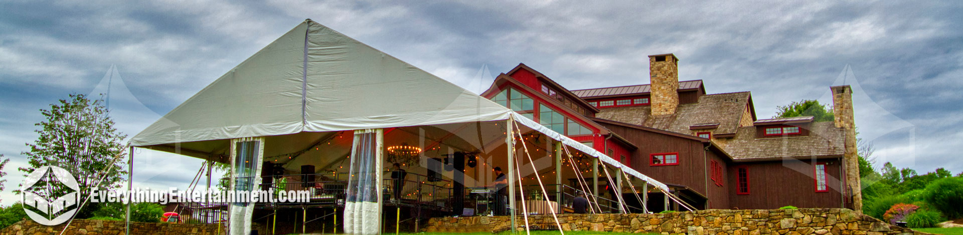 very large tent on a raised floor in a New Jersey backyard