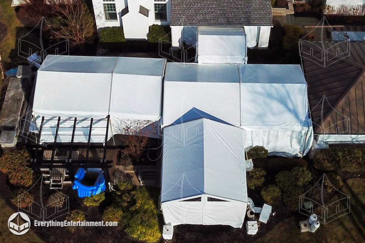 Aerial perspective of a multi-tent winter installation seamlessly connecting outdoor living spaces at a private Alpine NJ estate by Everything Entertainment.