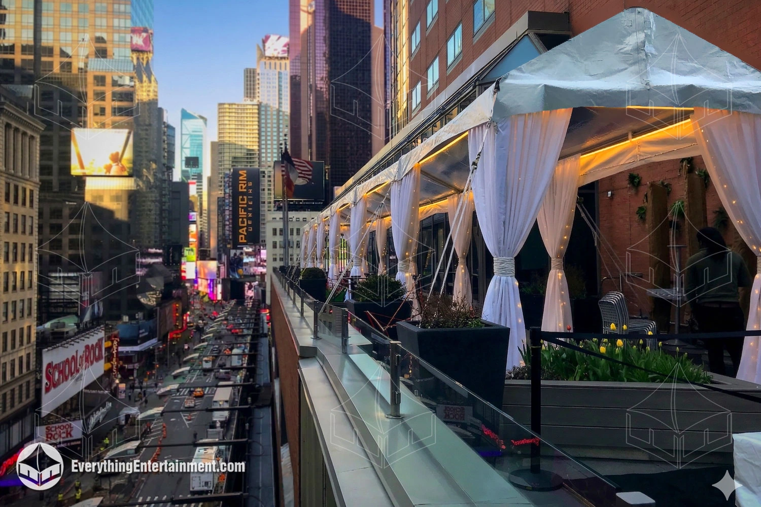 Long 10x90 white frame tent installed on a Manhattan hotel rooftop terrace overlooking the NYC skyli
