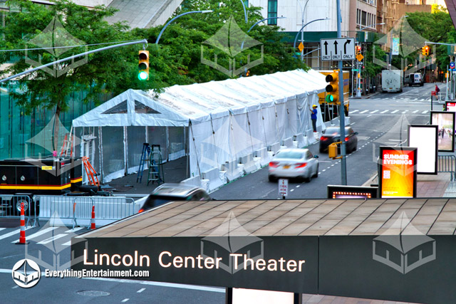 A long what frame tent setup on a Manhattan street in front of Alice Tully Hall with a Lincoln Center Sign in the foreground.
