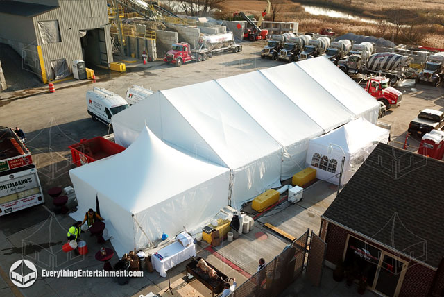 40x60 foot frame tent setup on asphalt to use as temporary warehouse space