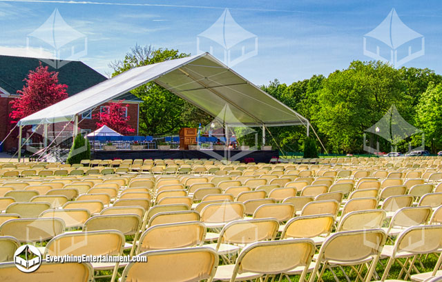 30x40 stage, covered by a 50x30 Open Gable Ended Maxi-Frame Tent for a College Commencement.