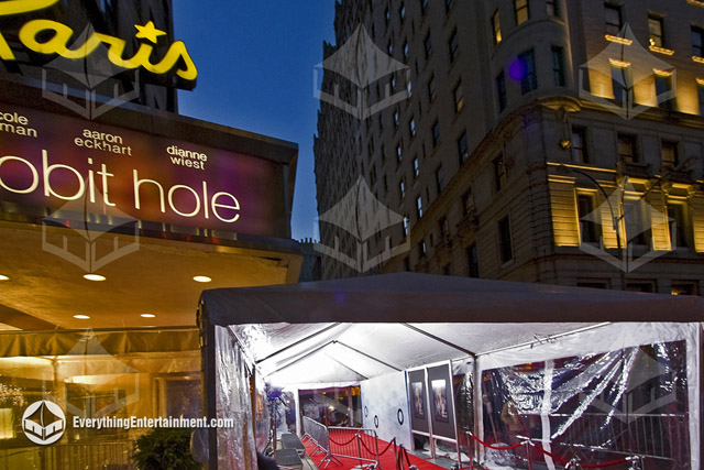 Interior and exterior view of a tent setup with a red carpet for a movie premiere at the Paris Theater in NYC