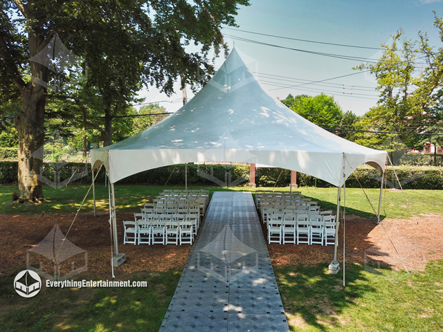 High Peak hex tent with temporary plastic flooring isle and chairs setup for wedding ceremony