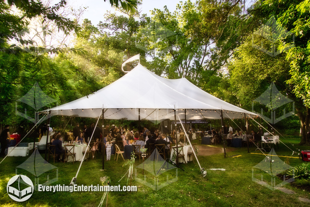 sailcloth tent setup for backyard wedding