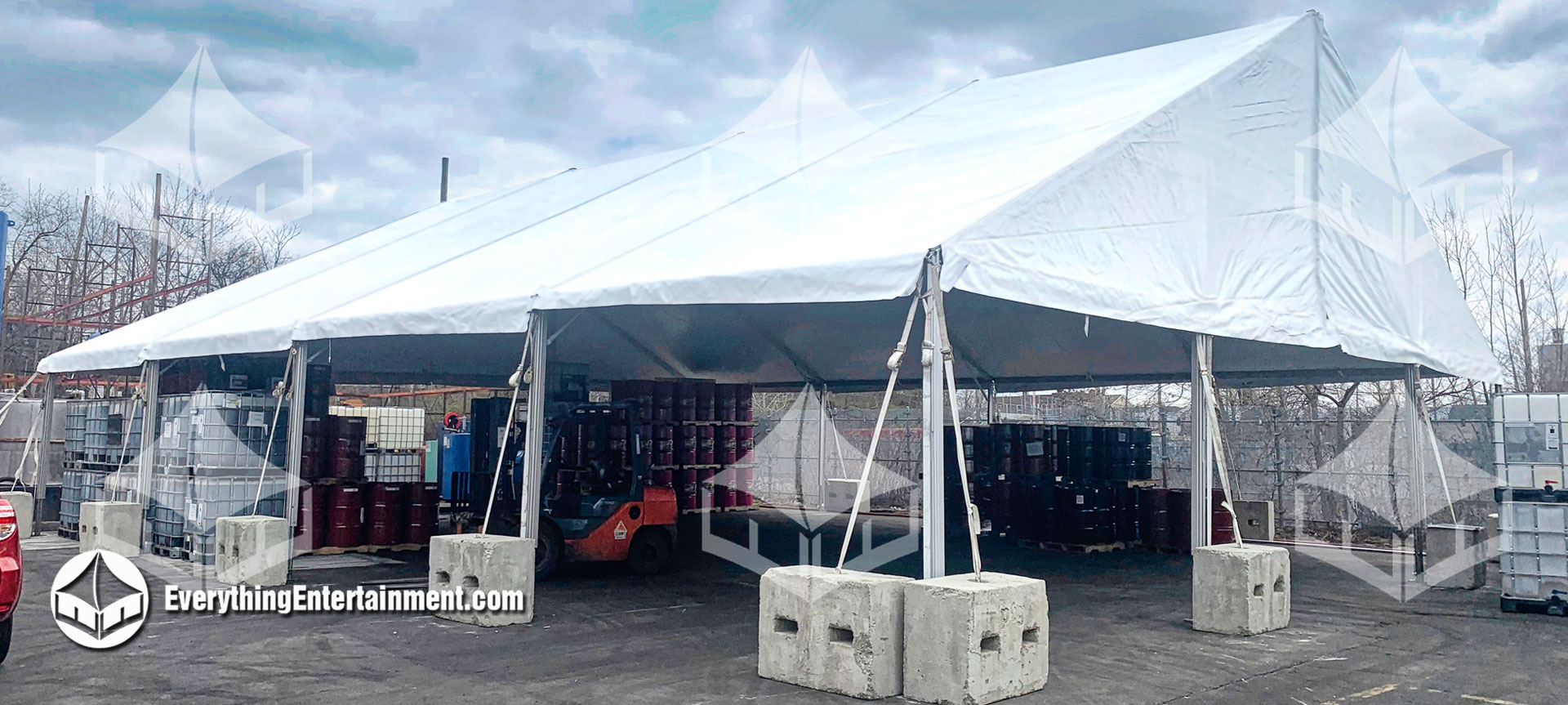 50x60 foot tent setup on asphalt to use as temporary warehouse space