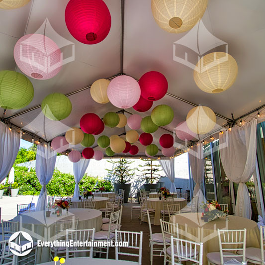 Tent with colorful paper lanterns and party rentals