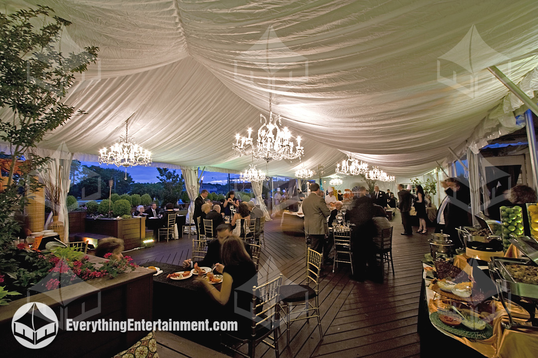 Crystal Chandeliers hanging in a 30x60 frame tent with white fabric liner