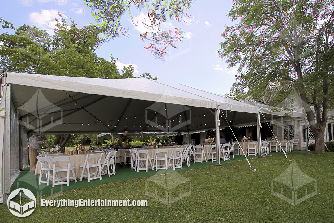 30x60 foot frame tent setup on grass