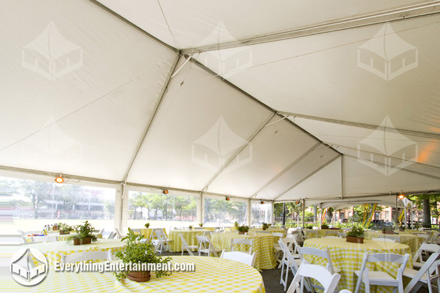 Interior view of a large frame tent rental with spring decor.